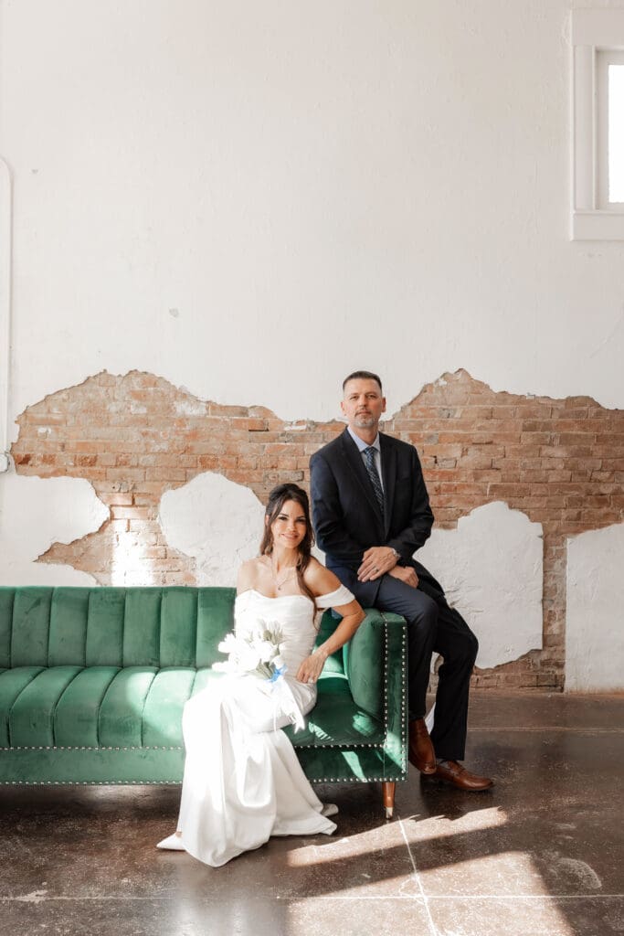 Bride and groom posing for photos inside Soma Winery in Fort Worth, TX