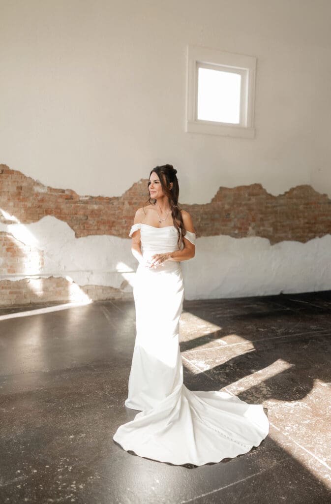Bride posing for photos inside Soma Winery in Fort Worth, TX