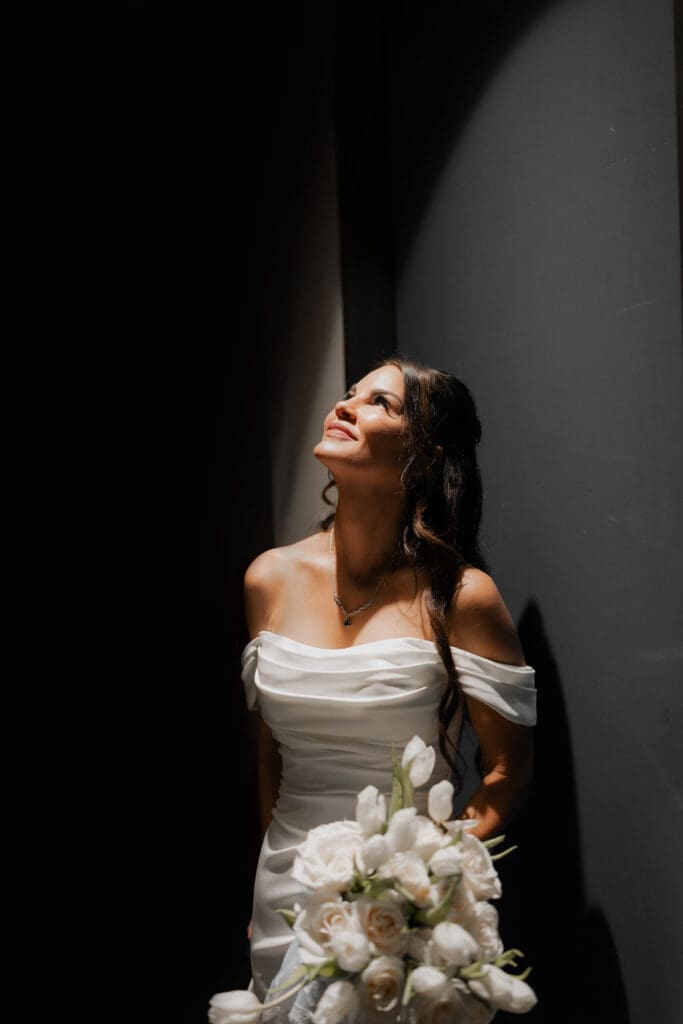 Bride in dramatic lighting at her wedding at Soma Winery in Fort Worth, TX