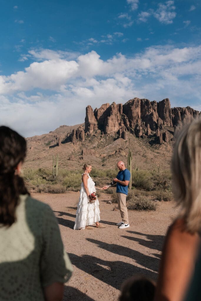 Bride and groom exchanging vows amongst the desert landscape at Lost Dutchman State Park in Arizona