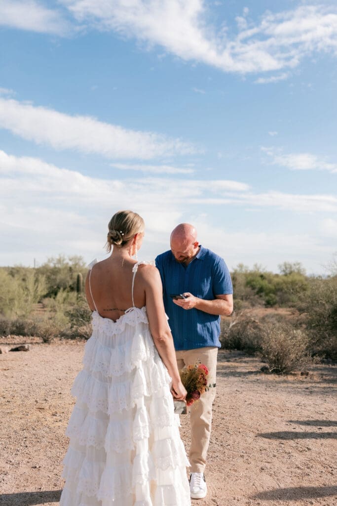 Bride and groom exchanging vows amongst the desert landscape at Lost Dutchman State Park in Arizona