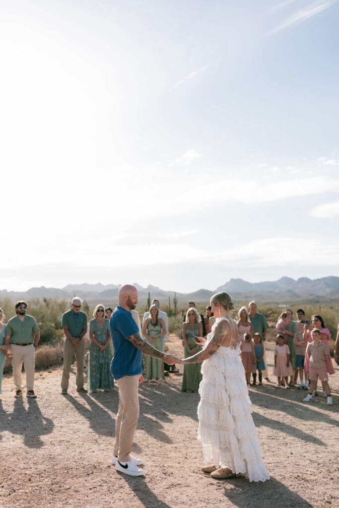 Bride and groom exchanging vows amongst the desert landscape at Lost Dutchman State Park in Arizona