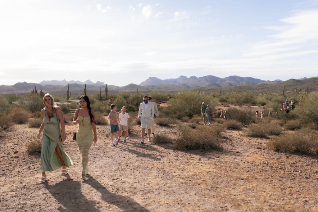 Guests walking up the trail to Kressyn and Casey's Lost Dutchman wedding in Arizona