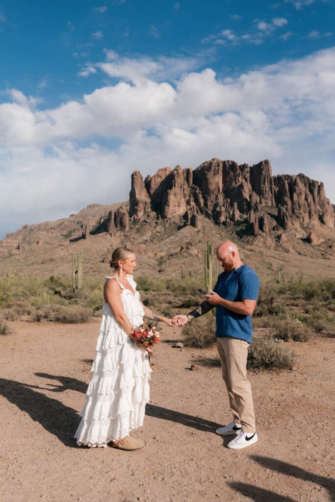 Bride and groom exchanging vows amongst the desert landscape at Lost Dutchman State Park in Arizona
