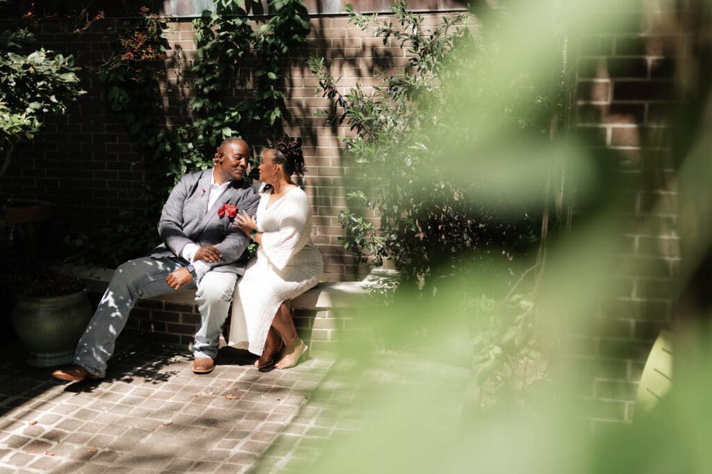 Moody portraits of a man and woman posing during their engagement session in downtown in Fort Worth, TX
