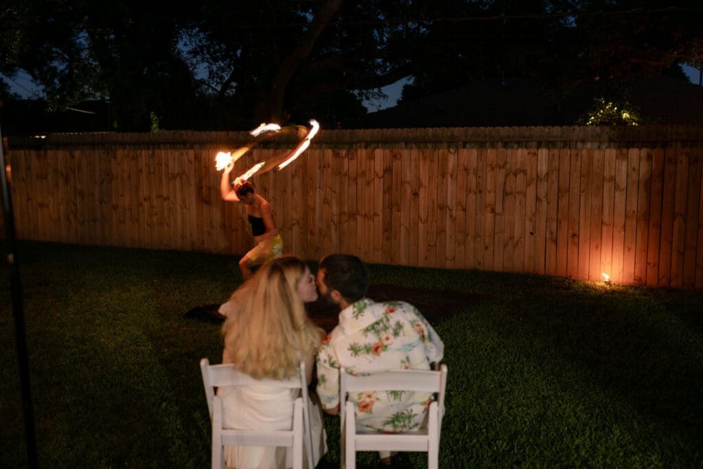 Bride and groom's rehearsal dinner in their backyard in Houston, TX with Polynesian hula dancers