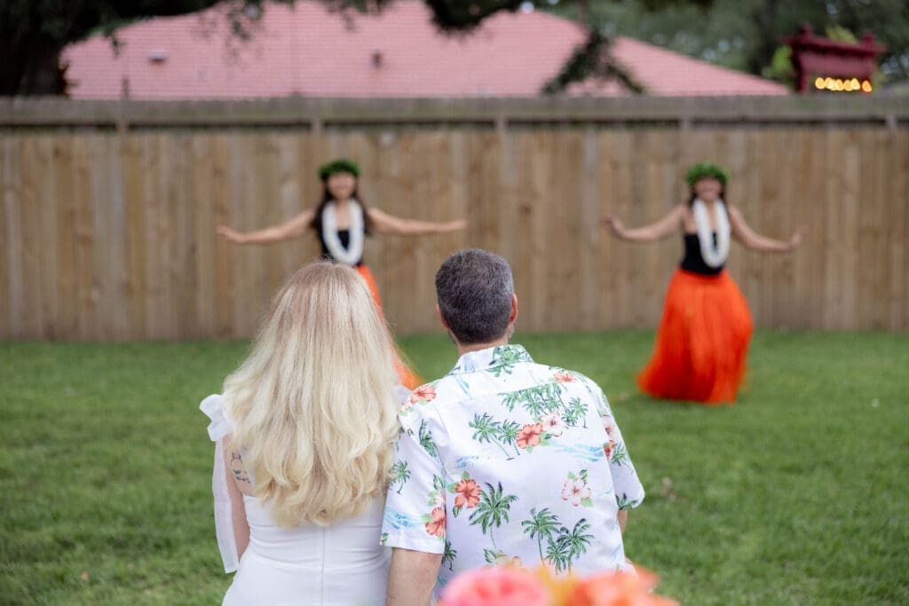 Bride and groom's rehearsal dinner in their backyard in Houston, TX with Polynesian hula dancers