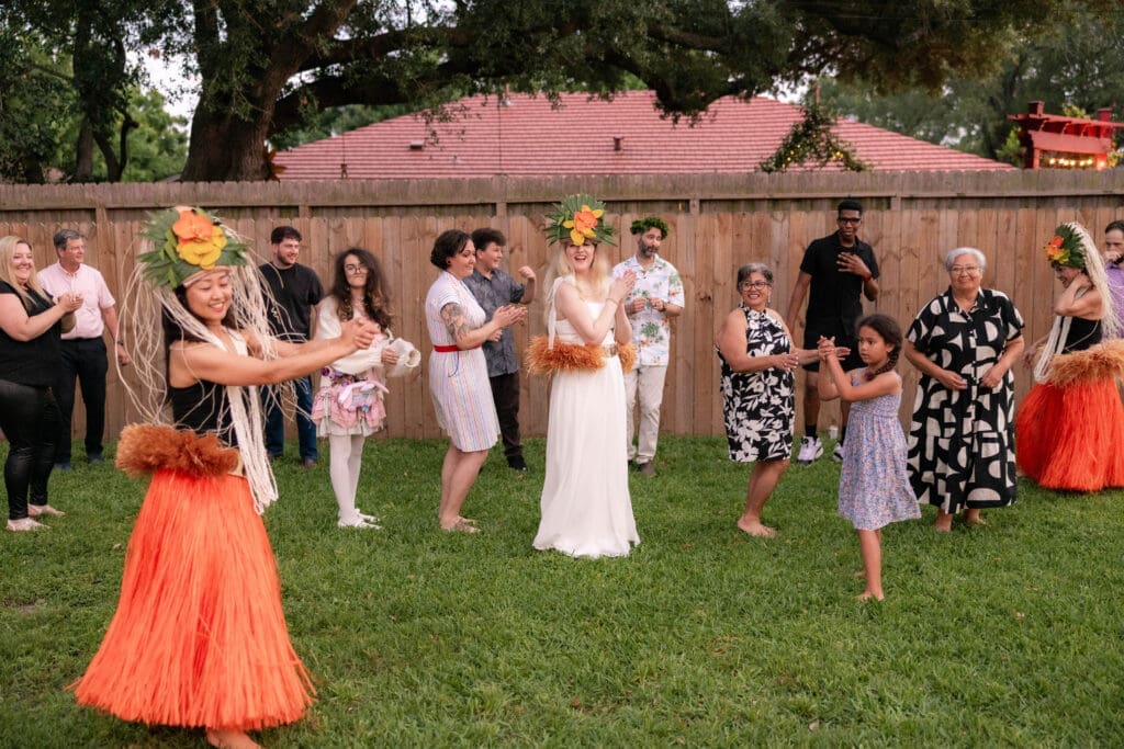 Bride and groom's rehearsal dinner in their backyard in Houston, TX with Polynesian hula dancers