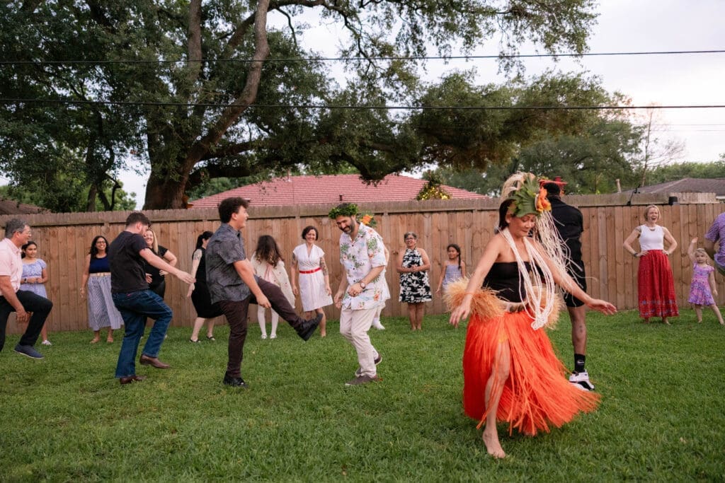 Bride and groom's rehearsal dinner in their backyard in Houston, TX with Polynesian hula dancers