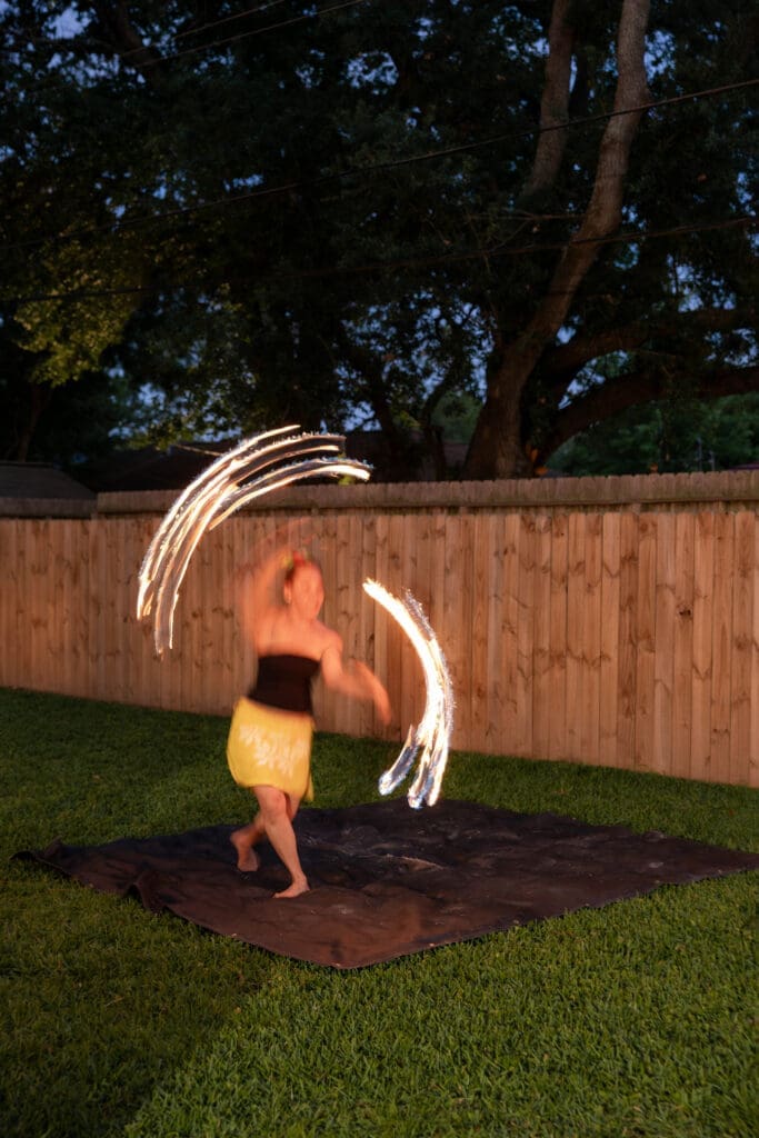 Bride and groom's rehearsal dinner in their backyard in Houston, TX with Polynesian hula dancers