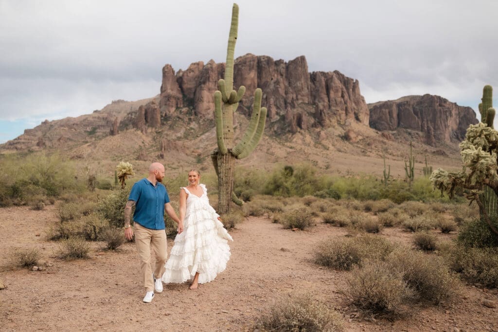 Portrait of bride and groom amongst the desert landscape during their Arizona destination wedding at Lost Dutchman State Park