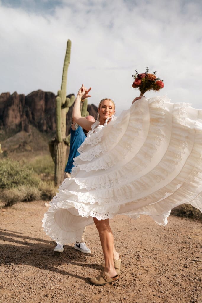 Portrait of bride and groom amongst the desert landscape during their Arizona destination wedding at Lost Dutchman State Park