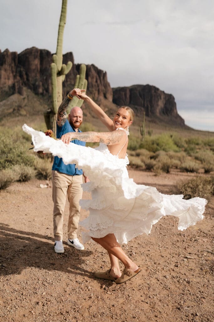 Portrait of bride and groom amongst the desert landscape during their Arizona destination wedding at Lost Dutchman State Park