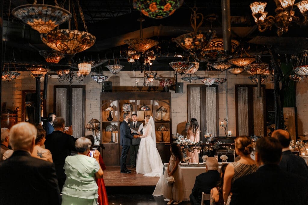 Katrina and Nick exchanging vows during their Nouveau Antique Bar wedding in Houston, TX