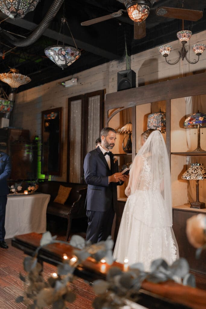 Katrina and Nick exchanging vows during their Nouveau Antique Bar wedding in Houston, TX