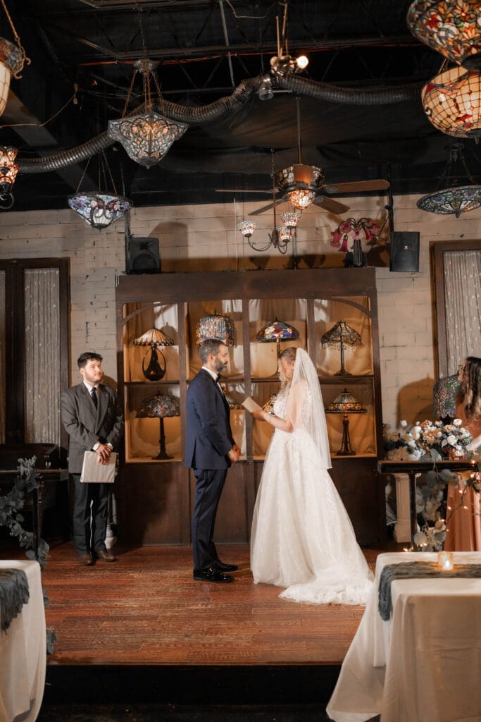 Katrina and Nick exchanging vows during their Nouveau Antique Bar wedding in Houston, TX