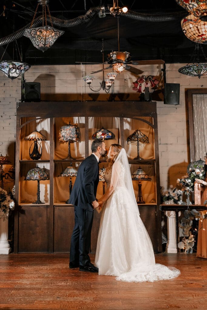 Katrina and Nick exchanging vows during their Nouveau Antique Bar wedding in Houston, TX
