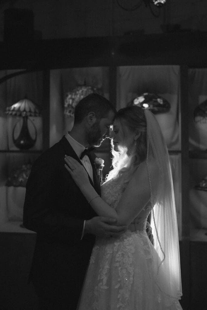 Bride and groom's moody indoor portraits at their Nouveau Antique Bar wedding in Houston, TX