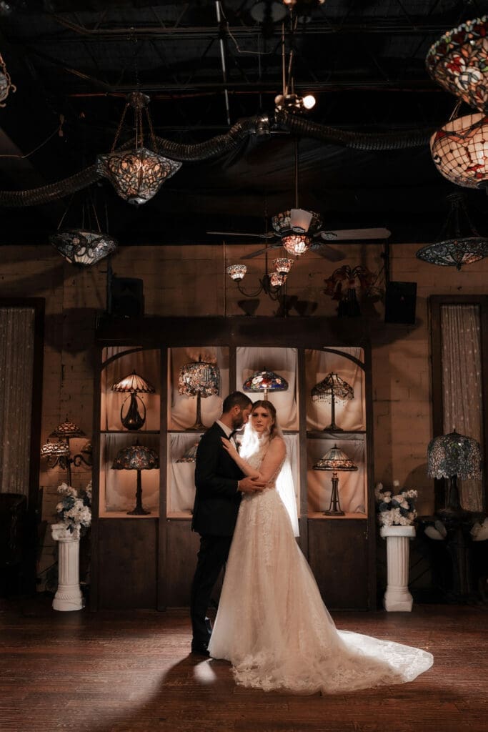 Bride and groom's moody indoor portraits at their Nouveau Antique Bar wedding in Houston, TX