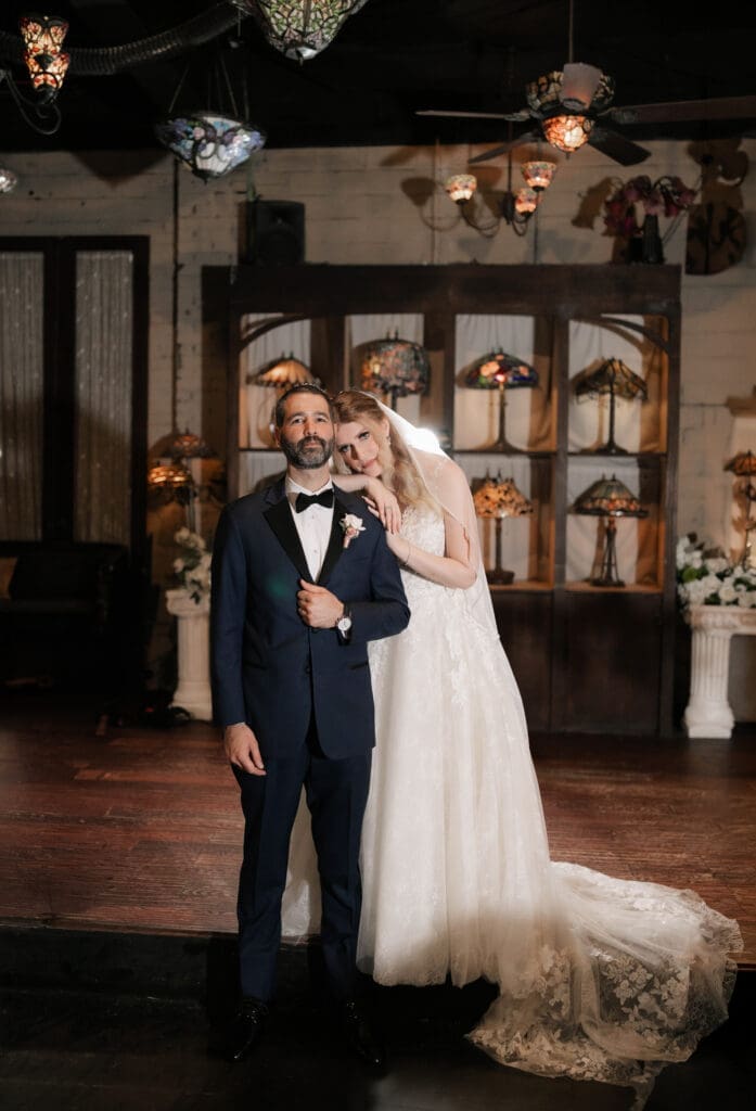 Bride and groom's moody indoor portraits at their Nouveau Antique Bar wedding in Houston, TX