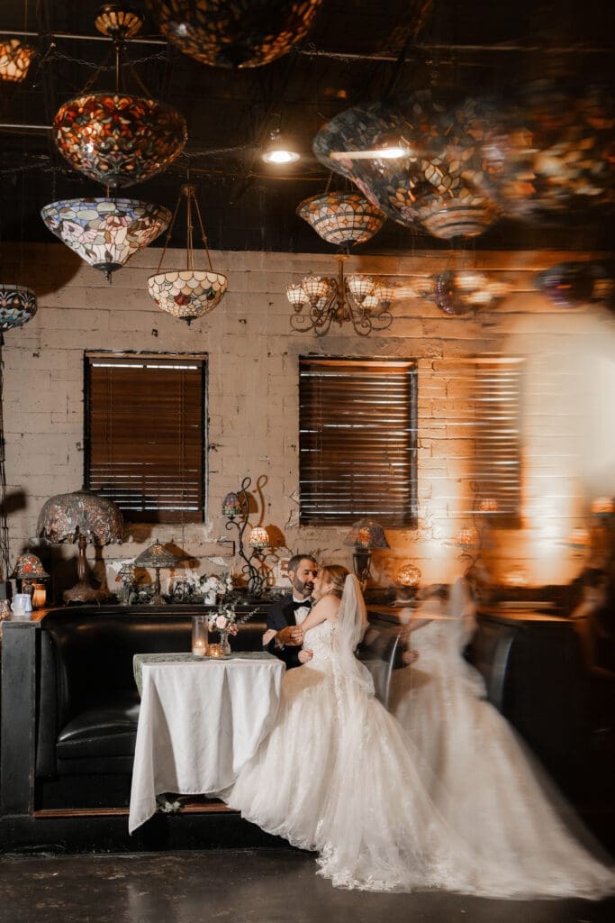 Bride and groom's moody indoor portraits at their Nouveau Antique Bar wedding in Houston, TX