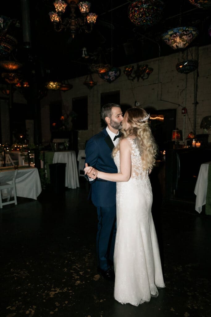 Bride and groom's last dance in an empty Nouveau Antique Art Bar