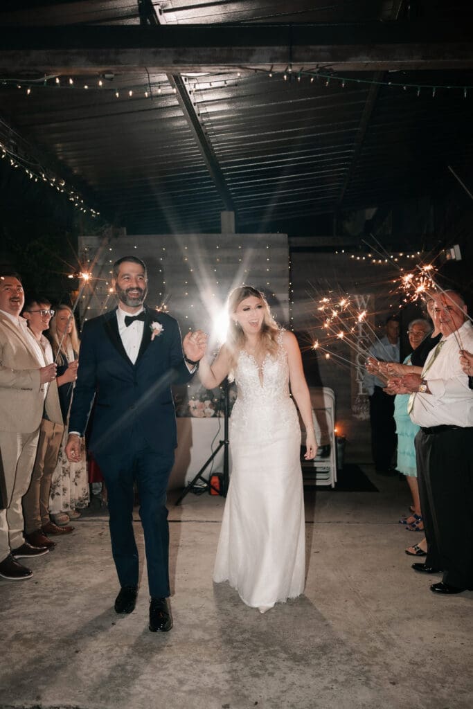Bride and groom's grand sparkler exit outside the Nouveau Antique Art Bar
