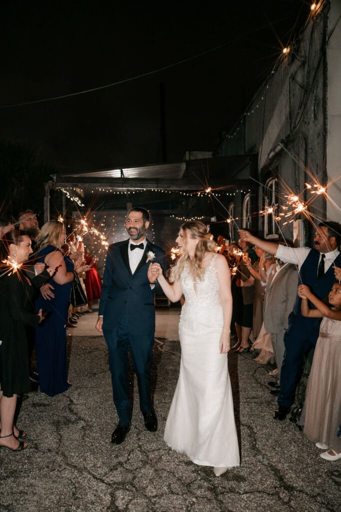 Bride and groom's grand sparkler exit outside the Nouveau Antique Art Bar