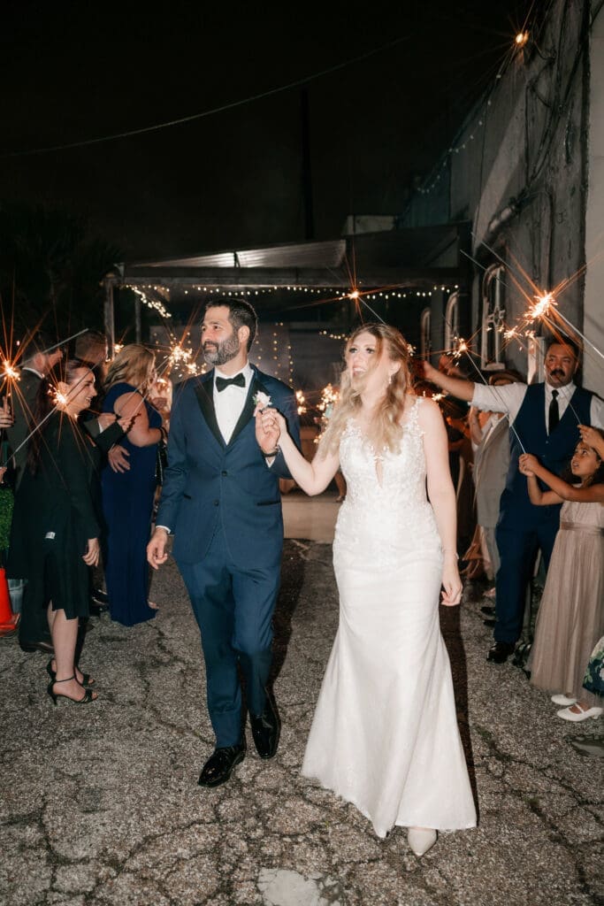 Bride and groom's grand sparkler exit outside the Nouveau Antique Art Bar