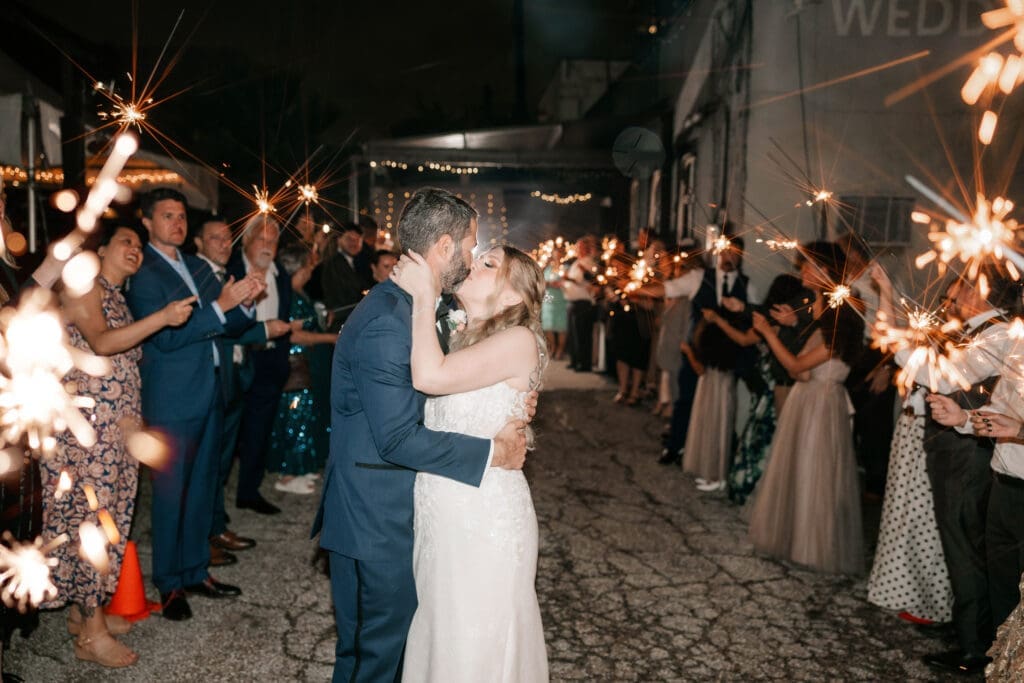 Bride and groom's grand sparkler exit outside the Nouveau Antique Art Bar