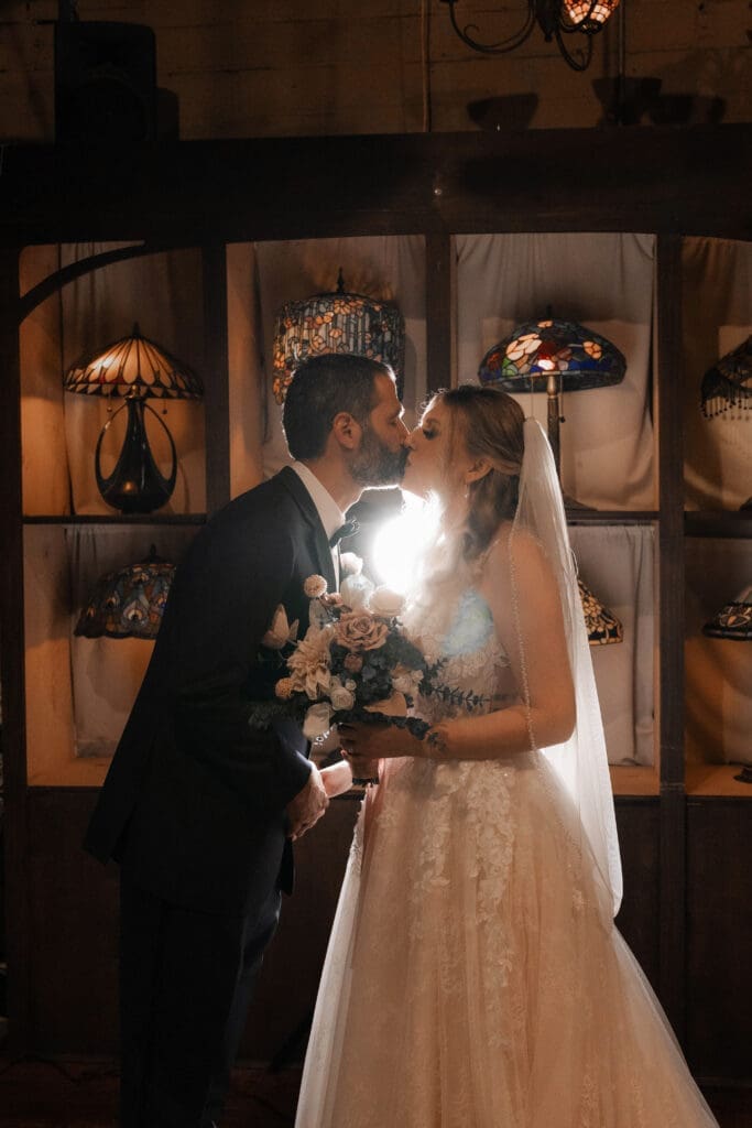 Bride and groom's moody indoor portraits at their Nouveau Antique Bar wedding in Houston, TX