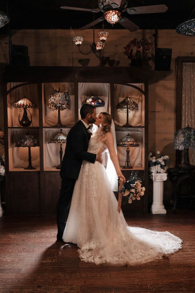 Bride and groom's moody indoor portraits at their Nouveau Antique Bar wedding in Houston, TX