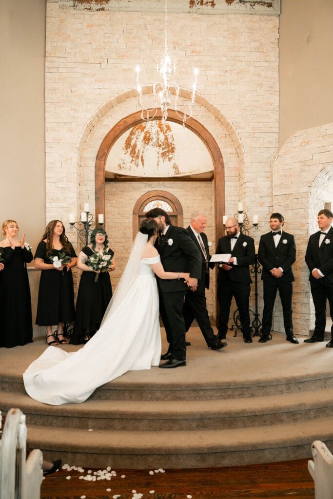 The 1906 wedding photographer taking photos of bride and groom at altar