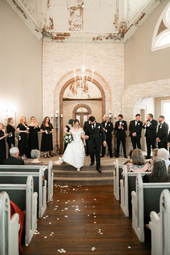 The 1906 wedding photographer taking photos of bride and groom at altar