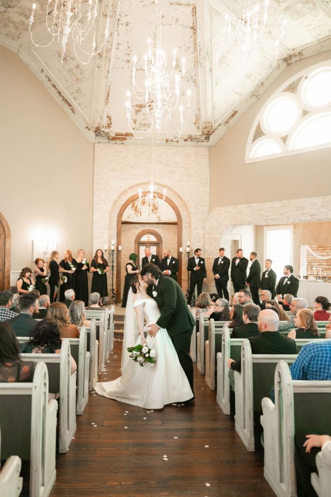 The 1906 wedding photographer taking photos of bride and groom at altar