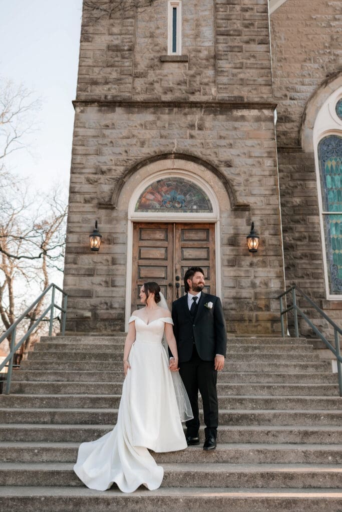 Bride and groom standing out front of  The 1906 venue