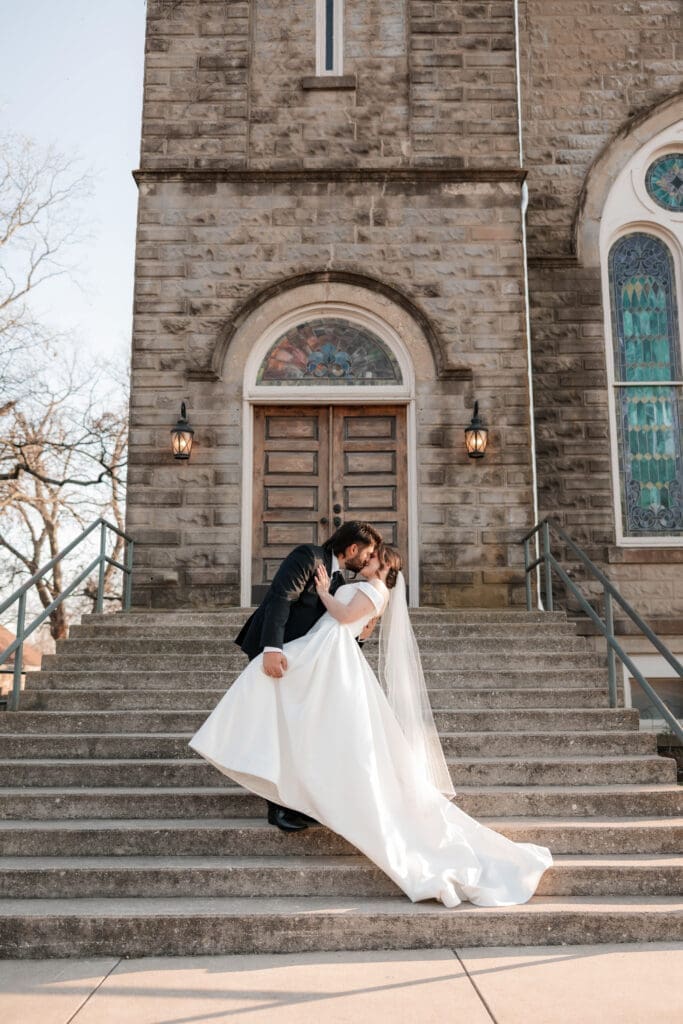 Bride and groom standing out front of  The 1906 venue