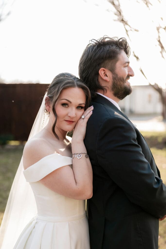 Bride and groom taking wedding portraits at The 1906 wedding venue in Whitesboro, TX