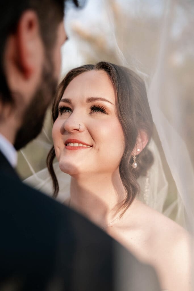 Bride and groom taking wedding portraits at The 1906 wedding venue in Whitesboro, TX