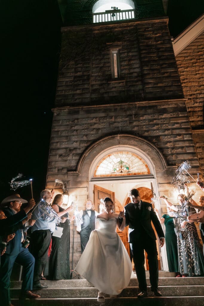 Bride and groom's grand exit with tinsel streamers