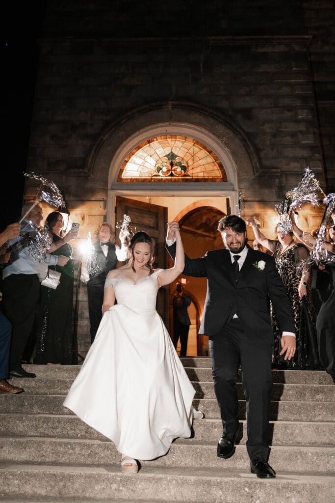 Bride and groom's grand exit with tinsel streamers