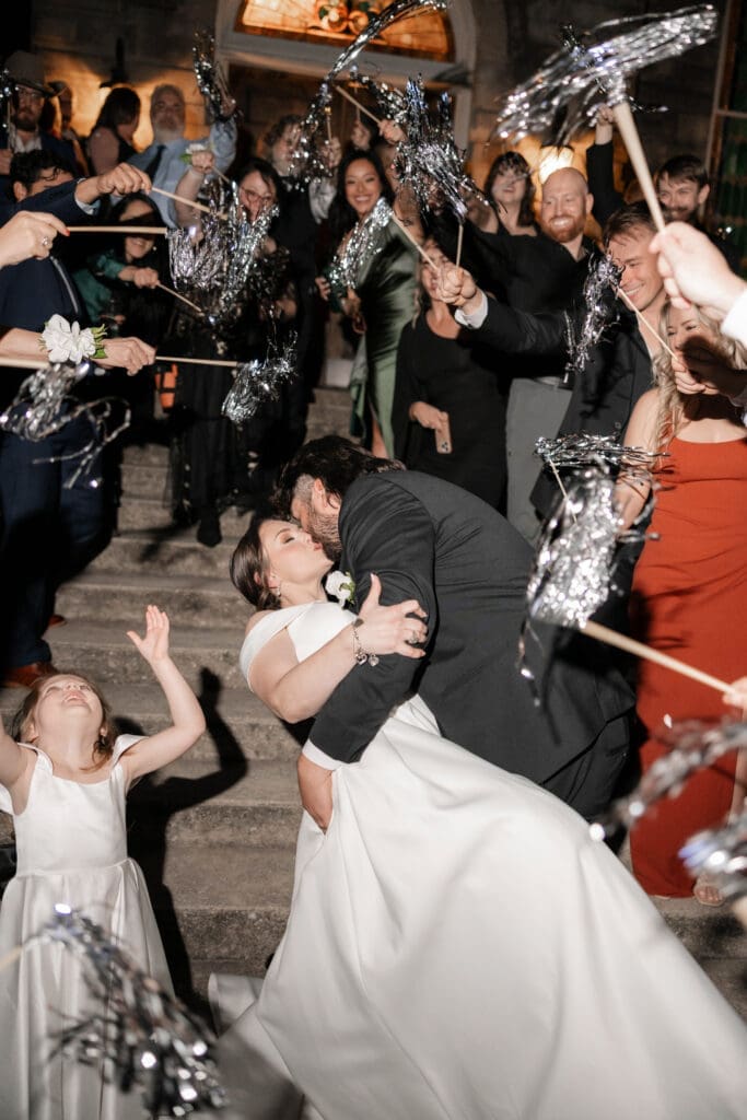 Bride and groom's grand exit with tinsel streamers