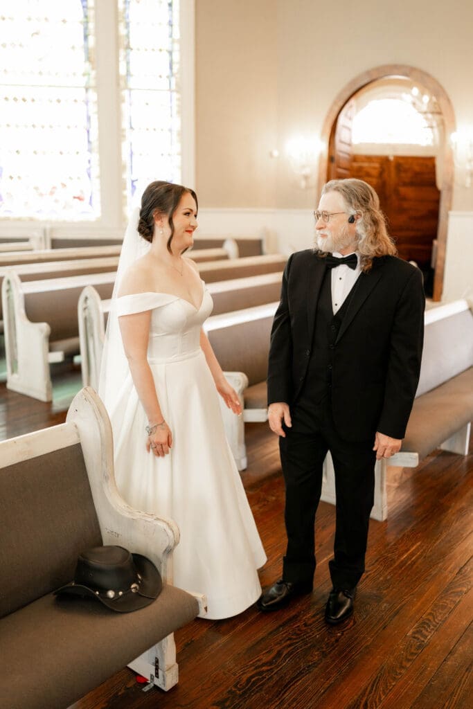 Bride's first look with her father at The 1906 wedding venue in Whitesboro, TX