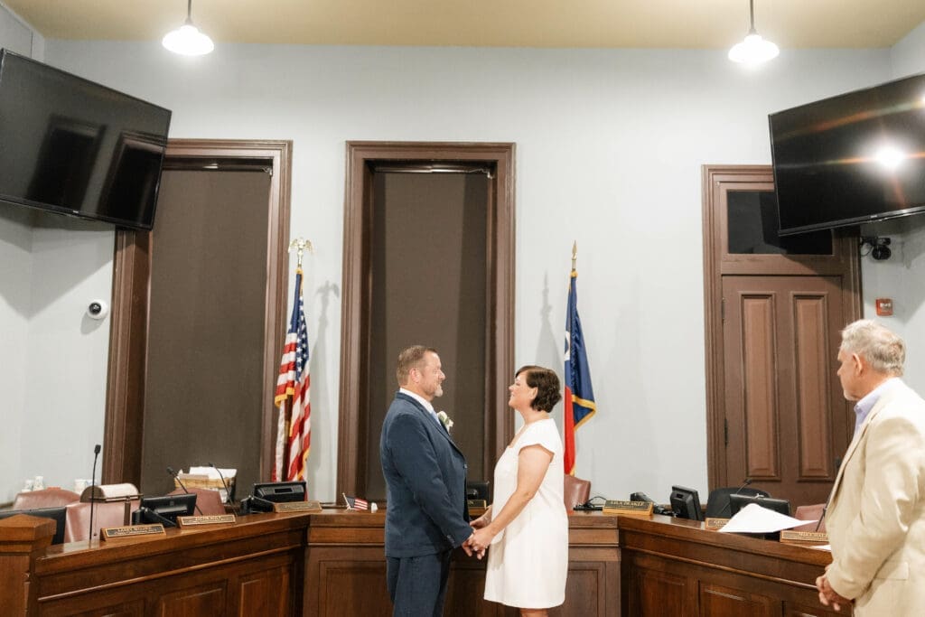 Michelle and Jason exchange vows during their Wedding ceremony inside the historic Weatherford courthouse