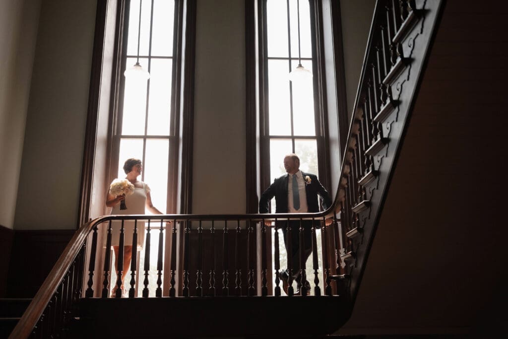 Bride and groom posing for silhouette portraits during their Downtown Weatherford Elopement 