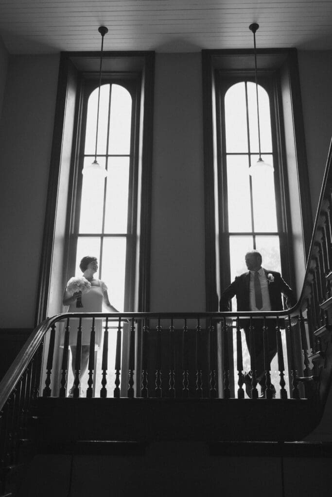 Bride and groom posing for silhouette portraits during their Downtown Weatherford Elopement 