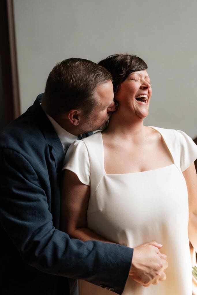 Bride and groom posing for portraits during their Downtown Weatherford Elopement 