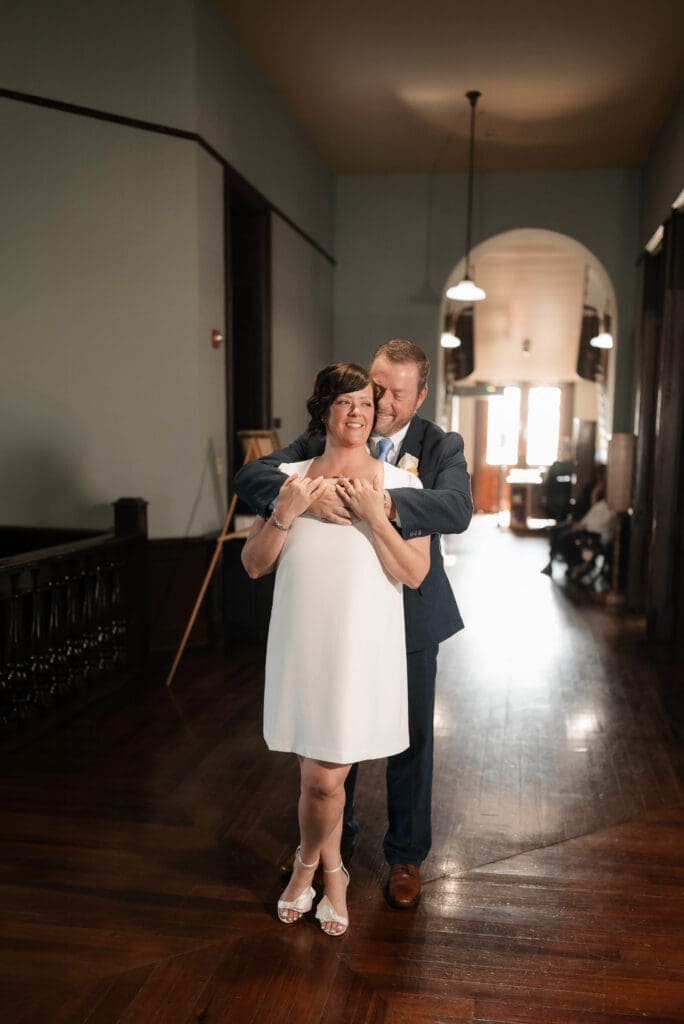 Bride and groom posing for portraits during their Downtown Weatherford Elopement 