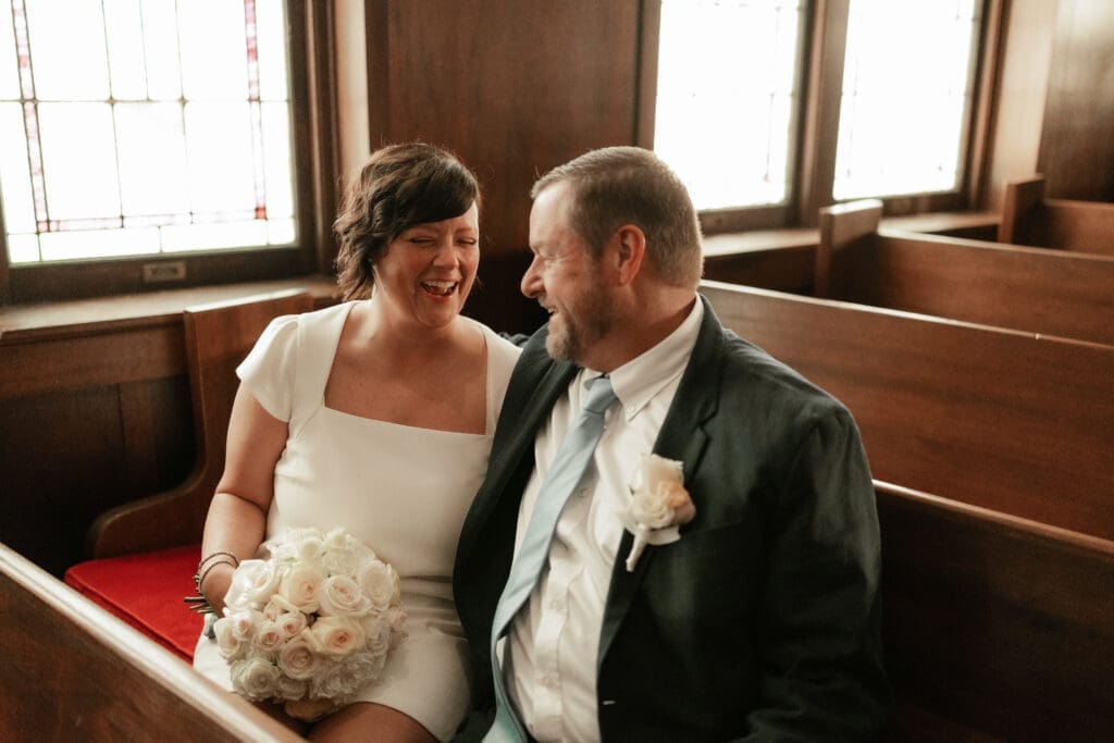 Bride and groom laughing and cuddling at another location after their Downtown Weatherford Elopement 