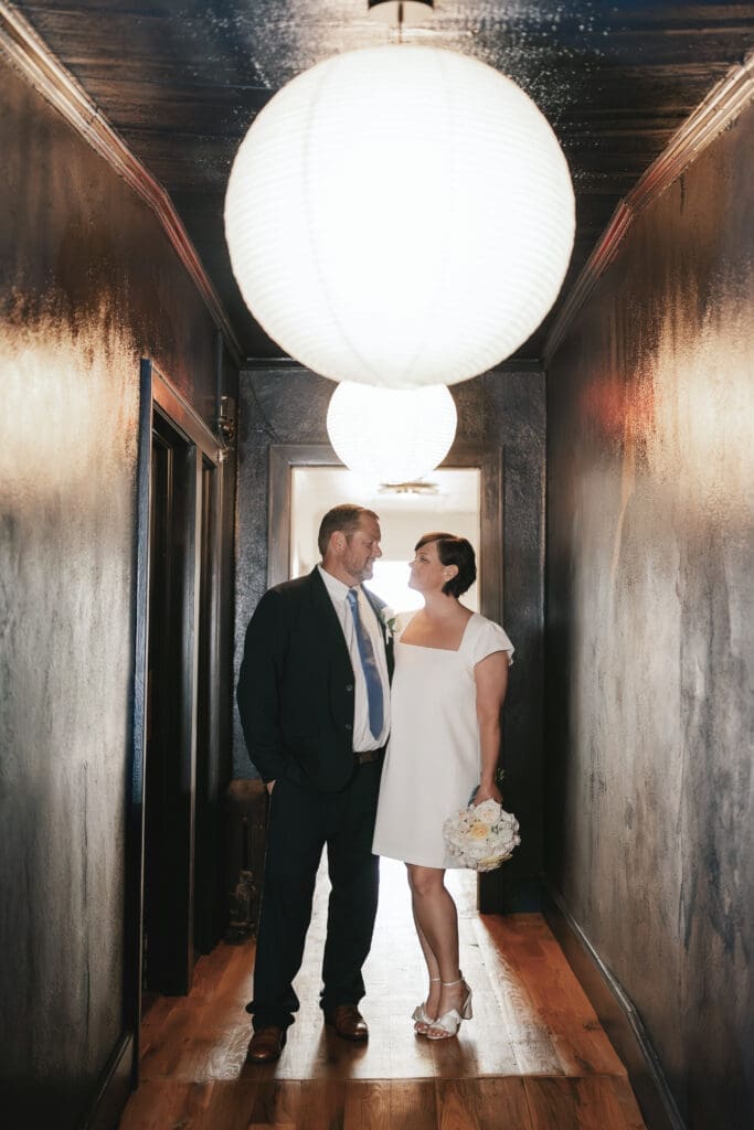 Bride and groom posing for portraits at another location after their Downtown Weatherford Elopement 